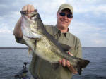 Danny Cavin of Martin Gas Company, Kilgore, TX. with a 9 pound fish he caught with  Pro Guide John Tanner on 11/13. This was his biggest bass ever!