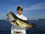 Reid Jones of Shreveport, LA with a nice bass caught while fishing with Pro Guide John Tanner 7-1-08.