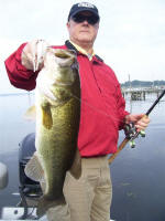 Mike Farrel from Ben E Keith Company with a trophy he caught while frog fishing with Pro Guide John Tanner on 9/18