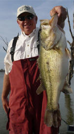 Pro Guide Gary Johnson with an 8 lb bass caught on a wacky worm March 6