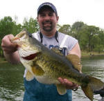 Mike with an 8 lb 11 oz bass he caught on 4/8 and a super fat 7-7 on 4/9. 