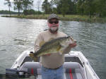 Pro Guide Tony Clark with a 8 lb. bass caught in 2 ft water