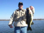 Bill from Michigan with a 7.12 ounce, his first Lake Fork bass. Caught while fishing with Pro Guide John Tanner 2/13/08 on a lipless crankbait.