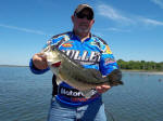 Tim with a bass caught while fishing with Pro Guide Eddie Garrett