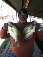 Joel Mosley with two nice crappie caught while fishing with Lake Fork Pro Guide Tom Evans