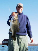 Pro Guide Tom Redington with a 7.5 Lake Fork bass caught on a Rattletrap.