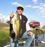  Kelly from Minnesota, enjoying big bass and warm sun on 3/20. Fishing with Pro Guide Tom Redington