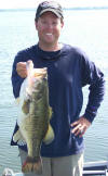 Pro Guide Tom Redington with a 9 pounder caught on a watermelon Lake Fork Top Dog lizard. 