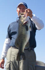 Pro Guide Tom Redington with a bass weighing almost 8 lbs 