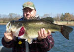 Fred is holding a 9.5 lb beauty caught 3-9-06 in the 40 mph winds.  Windy but fun! He was fishing with Pro Guide Tom Redington