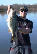 Dave Koopman of LaGrange, IL, caught this 8 pound 2 ounce bass from Lake Fork on 3/08/04 using a watermelon colored five inch worm. He used the fishing reports to help find the fish.