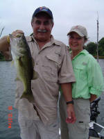 Alfredo also caught this bass weighing 6 lb 8 oz. Pictured also is wife Vannesa, who had never been fishing before in her life, caught 6 bass in the morning all between 4 1/2 and 5 pounds, two bluegills and several small channel catfish.