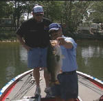 Randall Boyd of Honey Hole All Outdoors TV, with a 10.25 caught with Pro Guide John Tanner, while filming a TV show this past Monday, 4-17-06. Randall caught this hog on a 3 " green Cannibal by www.grandebass.com. Honey Hole All Outdoors airs at 5:30 on Sunday mornings.