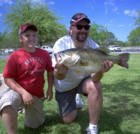 This HAWG was caught 4-7-06 at Lake Fork. It was my son's 16th B-Day! Dad caught it on a white jig in 1 foot of water. She weighed in at 11.85, 27 1/4 inches, and released back in at Lake Fork Marina! We caught a total of 9 fish, all 3 to 11 lbs!!!!! Happy Birthday to Jordan Lane, and dad Matthew Lane from North Richland Hills TX!!!