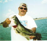 Derrick Demmers with a 7lb bass caught while fishing with Pro Guide Jimmy Everett