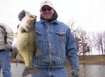 Gabe Newton from South Dakota with a hog he caught with Pro Guide John Tanner. Gabe's personal best, weighing 7.1