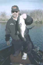 Lake Fork Pro Guide Jeff Gunn with a 9.12 bass he caught  March 2, 2004.