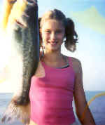 Almost 12 years old, Jessica Simonetti brings in her first big fish.