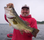 Scott Ames from Boston, Mass. with an 8.25 lb bass he caught with  Pro Guide John Tanner on 4/26. He caught this hog on a Cannibal by www.grandebass.com.