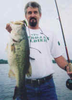Phil Sebolt from Georgia displays a trophy bass he caught while fishing with Lake Fork Pro Guide Tony Clark