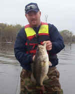 Wade Scott Dunn of Cimarron, Kansas displays one of the many bass he caught his first trip to Lake Fork.